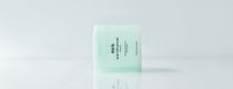 Abib Green LHA Pore Pad Clear Touch: jar on a reflective surface