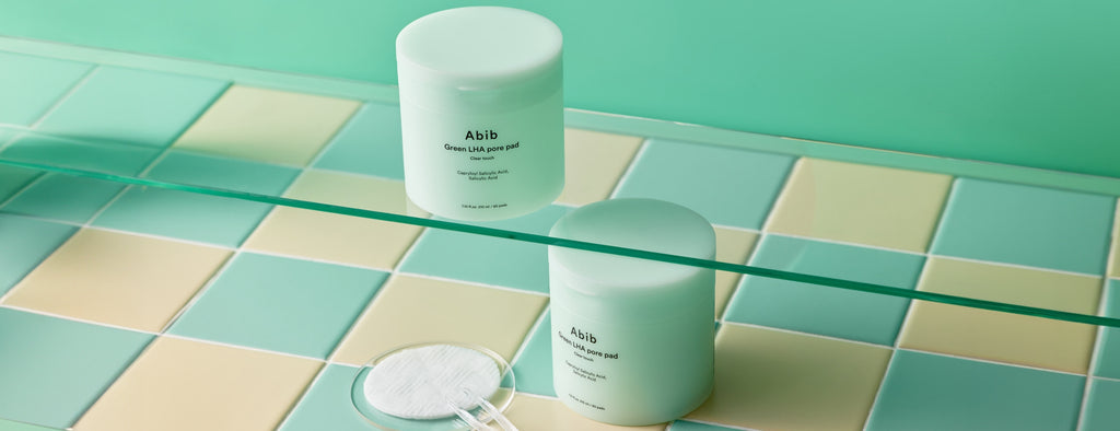 Abib Green LHA Pore Pad Clear Touch: Green LHA jars and pads on tiled shelves