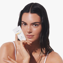 Anua Zero-cast Moisturizing Finish Sunscreen 50 ml: model holding the sunscreen tube