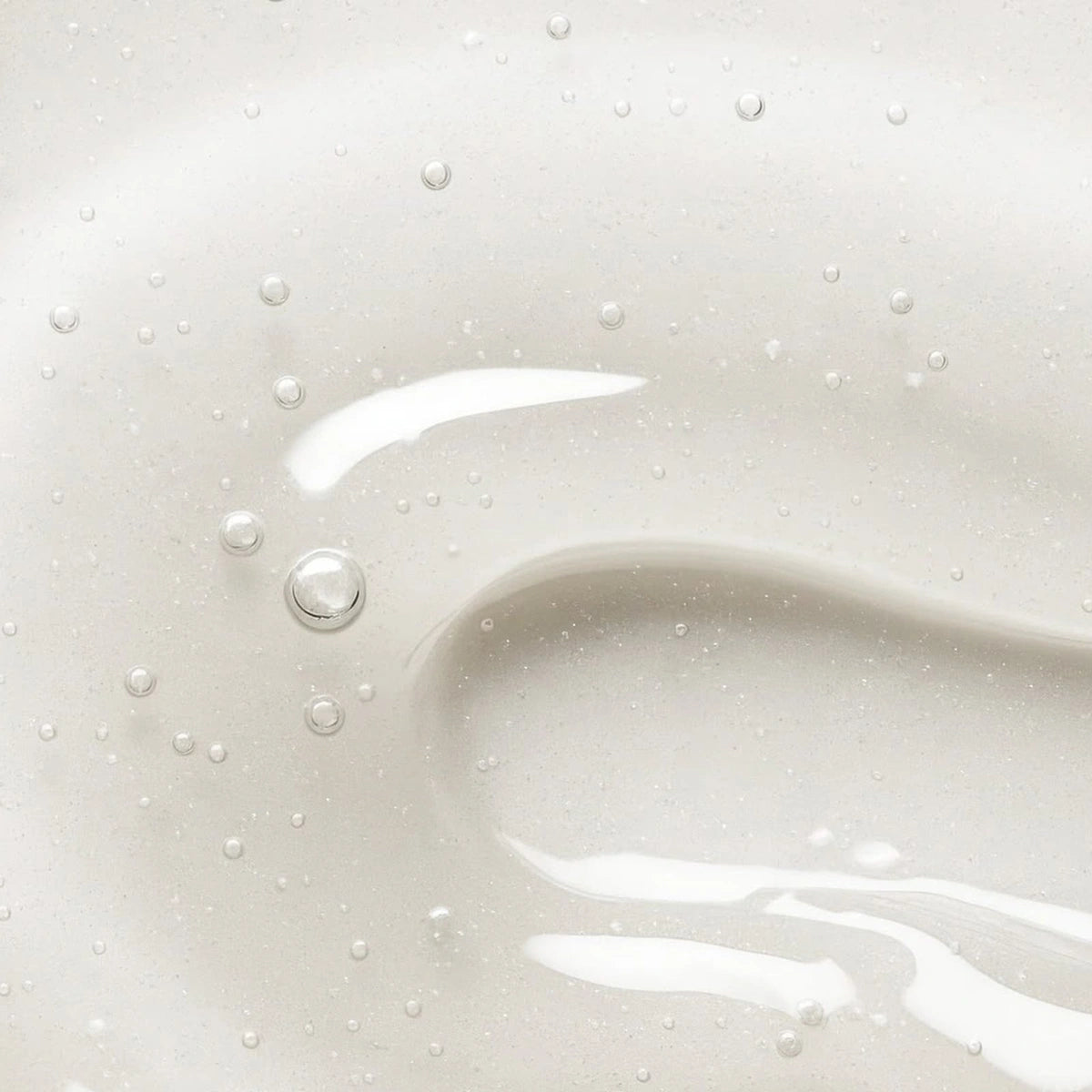 epii New Skin Toner Snow Mushroom & PHA — Gently exfoliates with 5% PHA to improve the look of uneven texture; texture close-up.