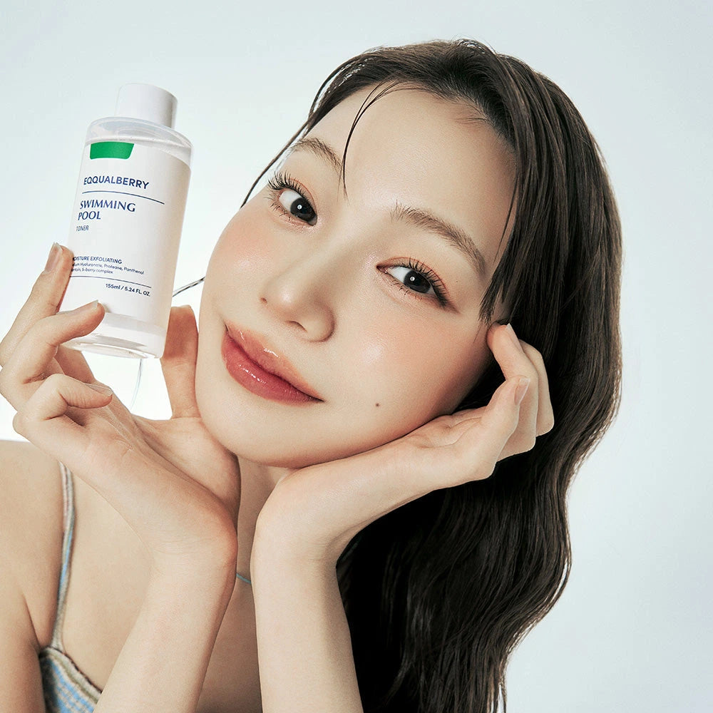 Eqqualberry Swimming Pool Toner — Leaves skin soft and prepared for the next skincare steps; | Model holding the toner