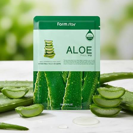 Farmstay Aloe Visible Difference Mask Sheet sachet beside sliced aloe leaves