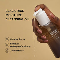 Haruharu Wonder Black Rice Deep Cleansing Oil — 150 ml cleansing oil bottle held in hand