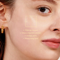 Haruharu Wonder Black Rice Deep Cleansing Oil - 150ml — close-up of a model’s cheek with manufacturer cleansing and finish labels.