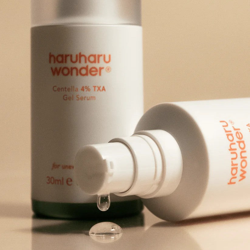 Haruharu Wonder Centella 4% TXA Gel Serum - 30ml — close-up of the 30 ml TXA serum’s exposed pump with a clear gel droplet in front.