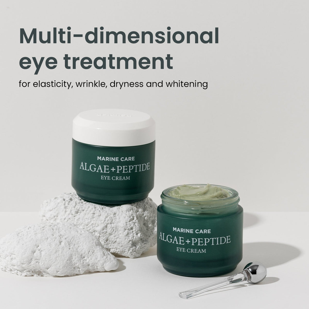 Heimish Marine Care Eye Cream - 30ml — two 30 ml eye-cream jars arranged with a stone in soft light.
