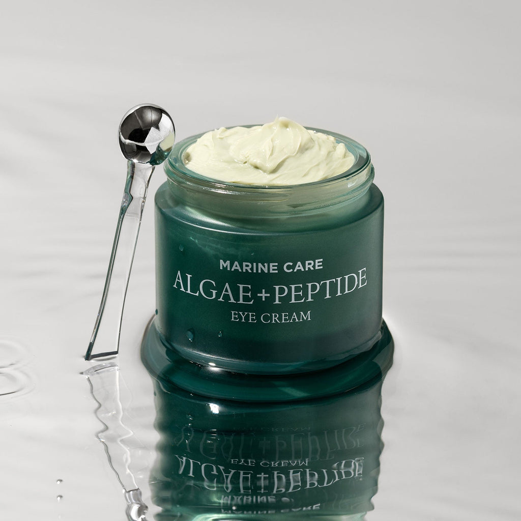 Open Heimish Marine Care Algae + Peptide Eye Cream jar with cream and metal applicator