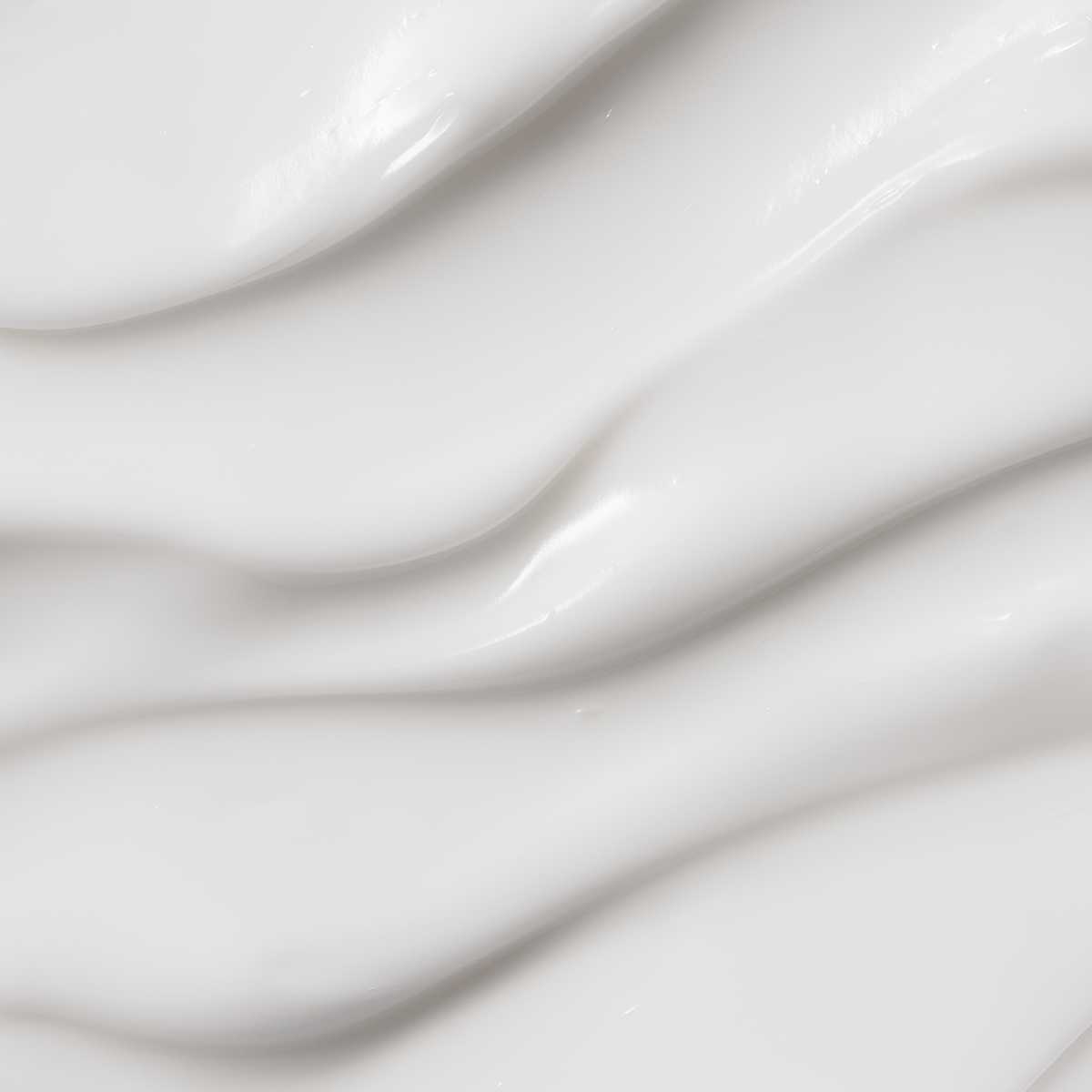 Heimish Moringa Ceramide Hyaluronic Hydrating Cream - 50ml — macro photograph of the cream’s smooth ridged texture.