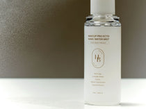 Heveblue Makeup Pro Ecto Namu Water Mist 50 ml — bottle in a sunlit setting.