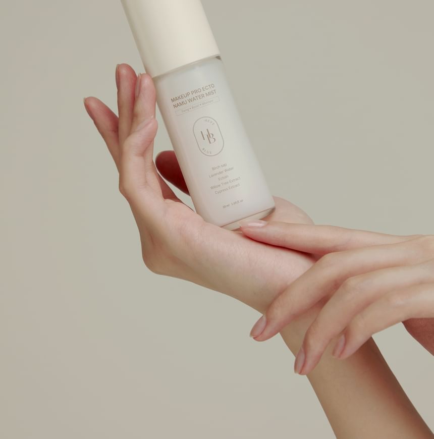 Heveblue Makeup Pro Ecto Namu Water Mist 50 ml — bottle held in the hand.