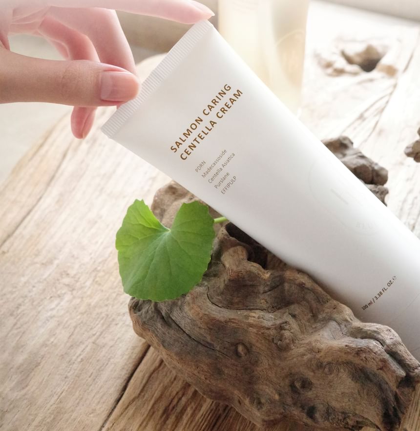Heveblue Salmon Caring Centella Cream 100 ml — tube with leaves and natural props.