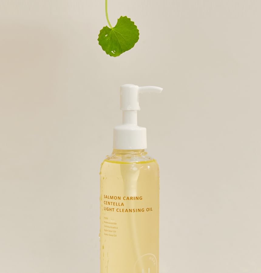 Heveblue Salmon Caring Centella Light Cleansing Oil - 250ml — bottle and centella leaf composition.