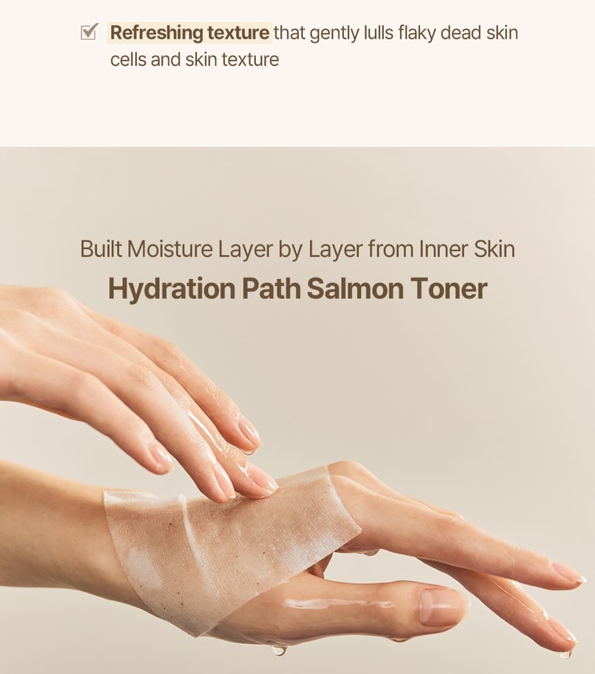 Heveblue Salmon Caring Centella Toner 200 ml — toner applied across the hand.