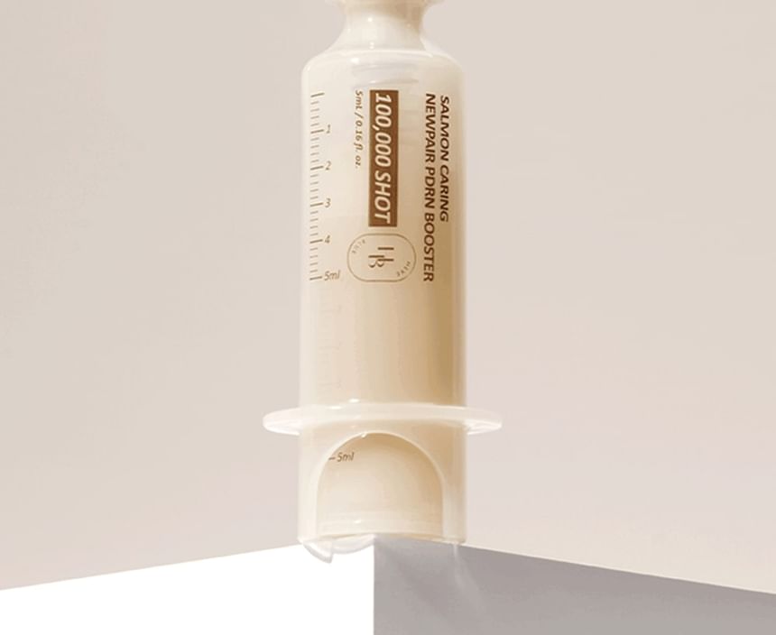 Heveblue Salmon Caring Newpair PDRN Booster 100,000 Shot Essence 5 ml — 5 ml booster dispenser detail.