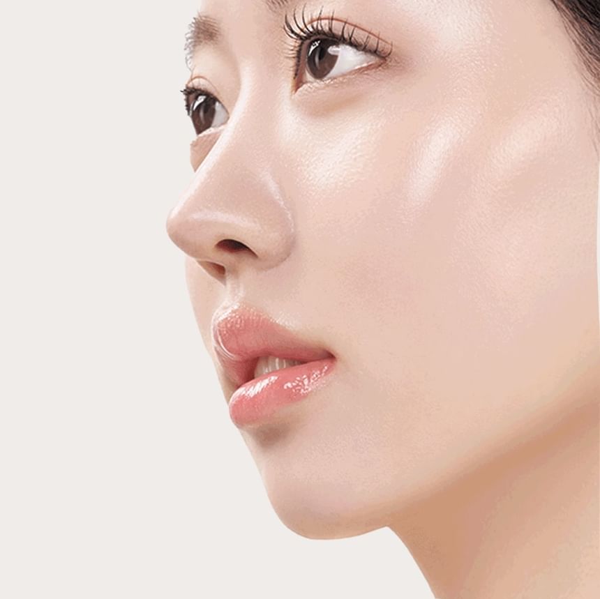 Heveblue Salmon Caring Newpair PDRN Booster 100,000 Shot Essence 5 ml — model skin close-up.