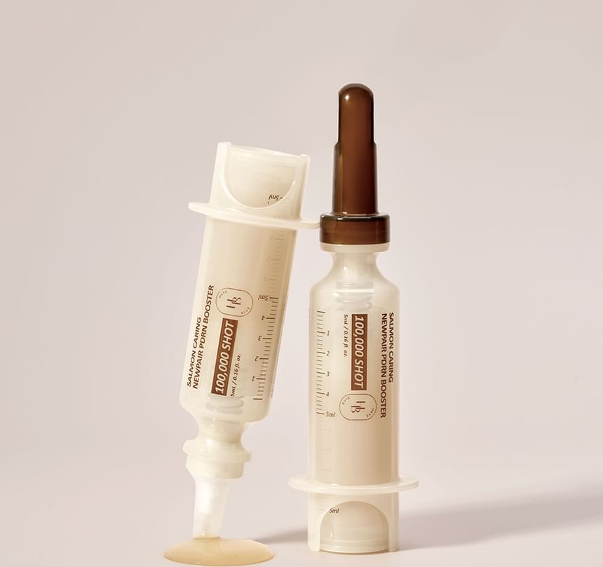 Heveblue Salmon Caring Newpair PDRN Booster 100,000 Shot Essence 5 ml — booster bottle with dispenser.