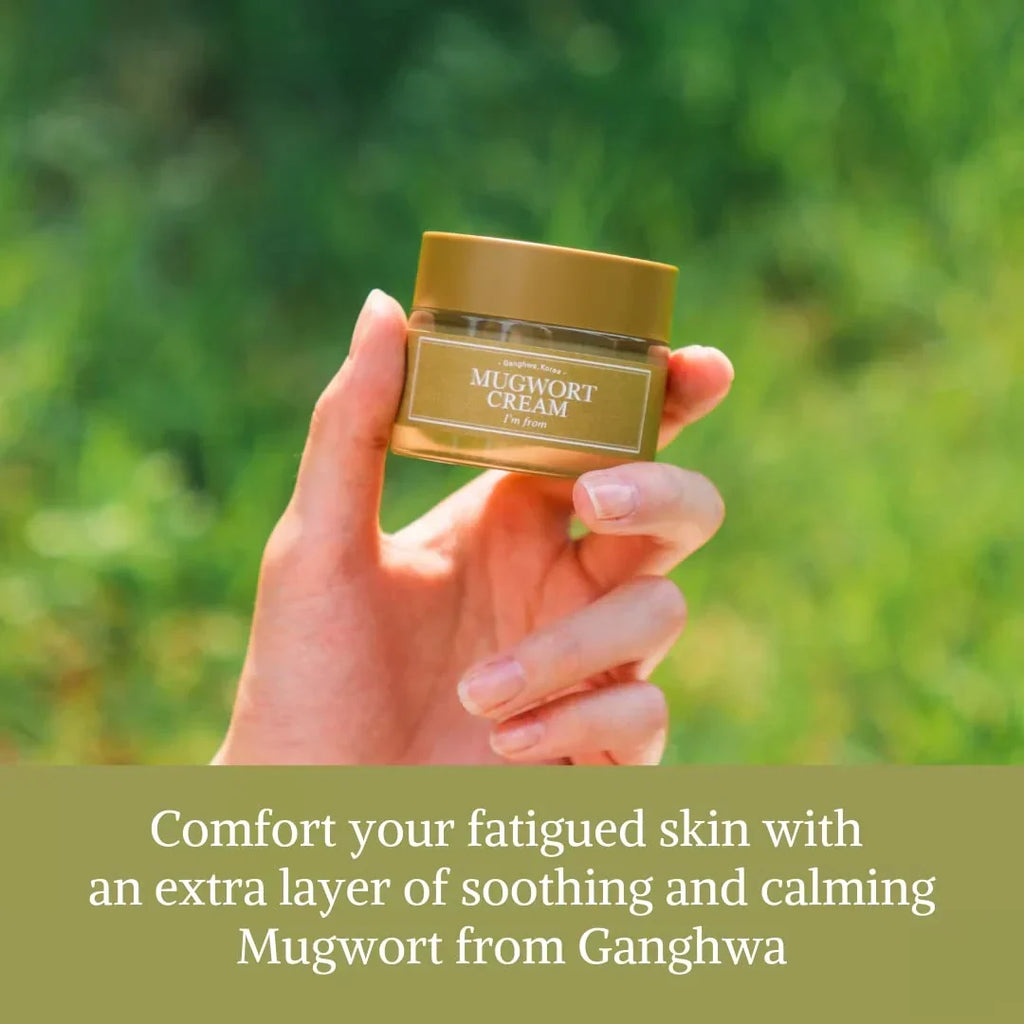 I'm From Mugwort Cream — hand holding the original mugwort-cream jar outdoors