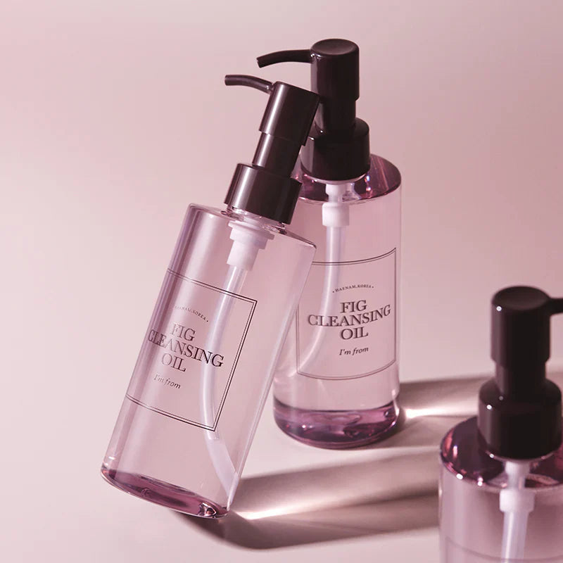 I'm From Fig Cleansing Oil — original bottles on a pink background